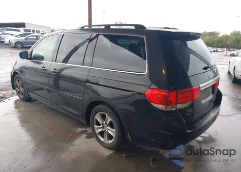 2010 Honda Odyssey Touring z USA, uszkodzony, nr VIN 5FNRL3H97AB039089